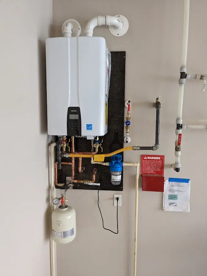 Professional plumber installing copper piping in a Arcadia home
